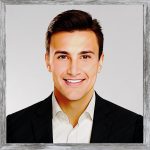 A watercolour painting of the school teacher Michael Rafone. In his late twenties, he has a pleasant smile and looks like a decent bloke, well groomed, dark brown hair and deep chestnut eyes. He's wearing a black suit jacket and a white shirt, but no tie. In his late twenties, he has a pleasant smile and looks like a decent bloke. The image is labelled OpenMike which is the name he uses every week at the Noble Coliseum when he hosts Saturday Night Fun Night.