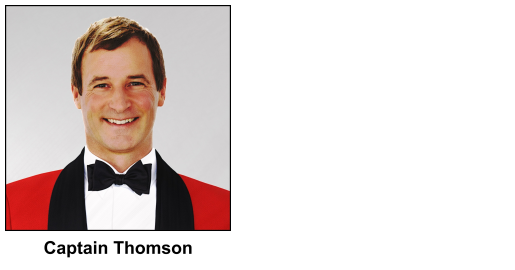 A watercolour painting of a military captain in the amalgated forces of Wolfland, wearing what looks like a bright red Royal Marines No.5 Mess Dress uniform. It has black lapels, and is accompanied by a black bow tie over a bright white wing collar dress shirt. Captain Thomson (aged 58 in this image) has light brown hair, worn a little long for a military man, a welcome smile, and deep brown eyes.